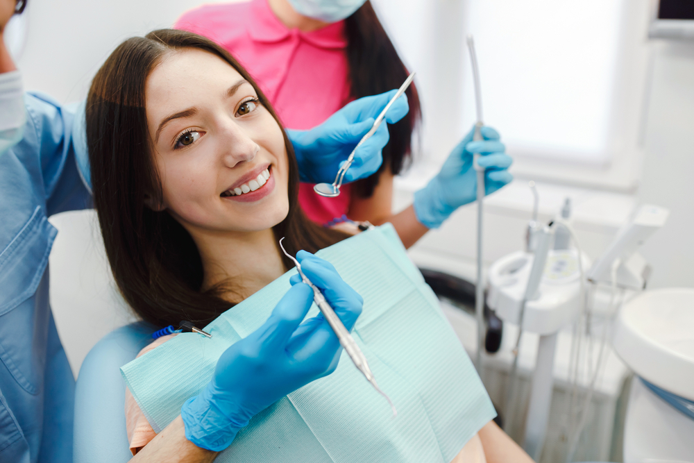 Assistant,Dentist,And,The,Patient,In,The,Clinic.