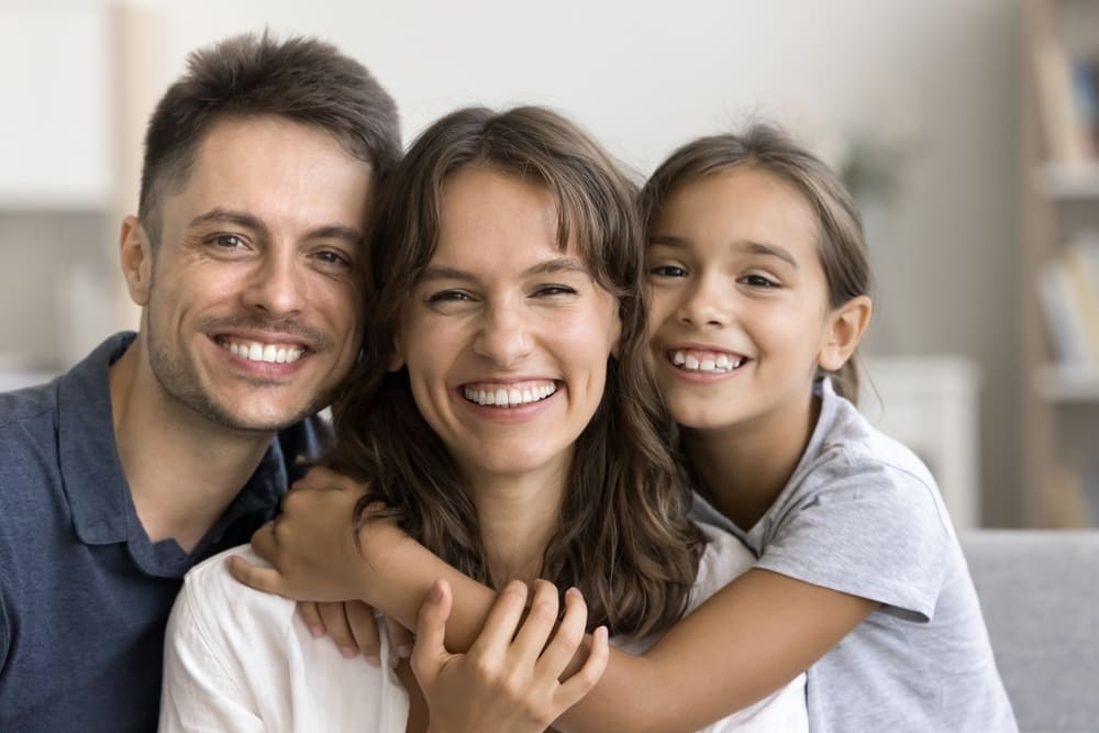 Authentic,Beautiful,Latin,Parents,And,Daughter,Smiling,Revealing,White,Teeth